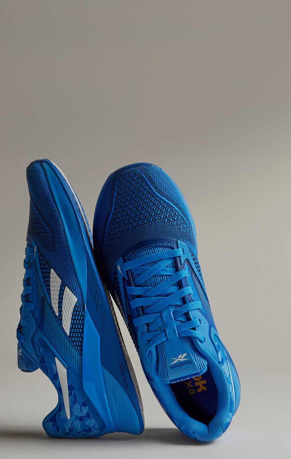 Blue athletic shoes on a gray background