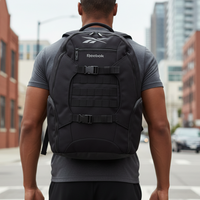 Man wearing a black Reebok backpack on a city street