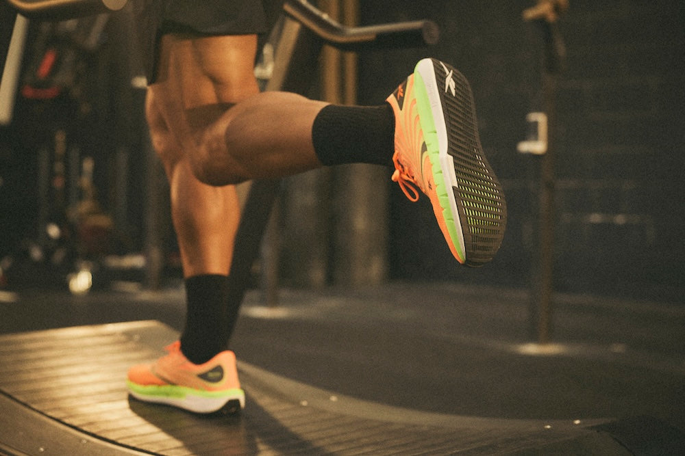 Close up of Christian Harris' feet in the FloatZig Tread, mid-sprint on the treadmill