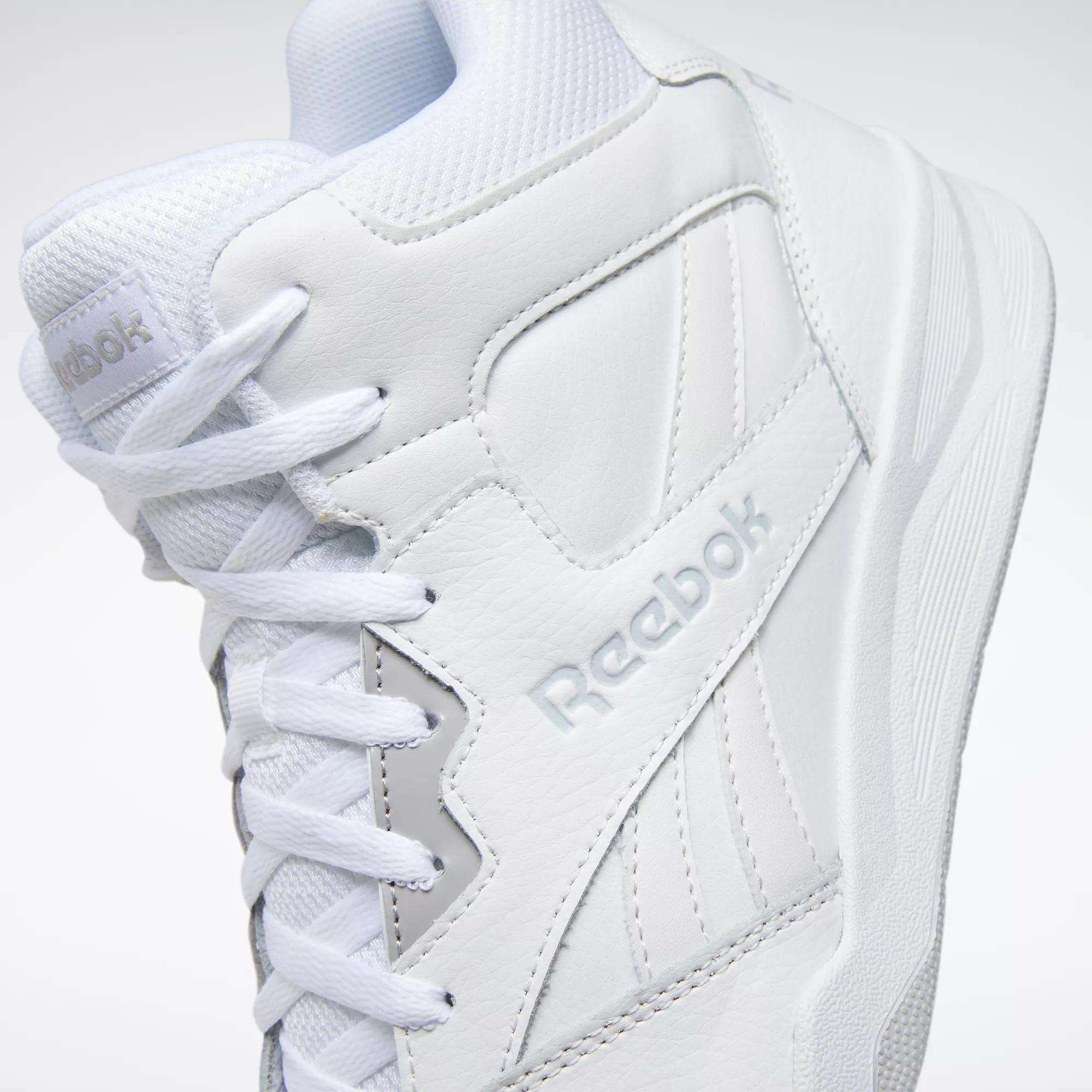 Close-up of the Reebok Men's Royal BB4500 Hi 2.0 Shoes, featuring '80s-inspired high-top design, visible stitching, textured leather, embossed Reebok logo, white laces, and a textured sole—a classic for your collection.