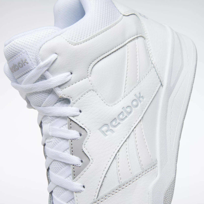 Close-up of the Reebok Men's Royal BB4500 Hi 2.0 Shoes, featuring '80s-inspired high-top design, visible stitching, textured leather, embossed Reebok logo, white laces, and a textured sole—a classic for your collection.