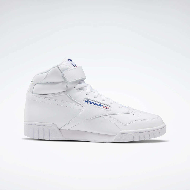 The Reebok Men's EX-O-FIT Hi Shoes are white, high-cut leather sneakers with a classic design, velcro strap, blue and red Reebok logo, and white sole, shown against a plain light background.