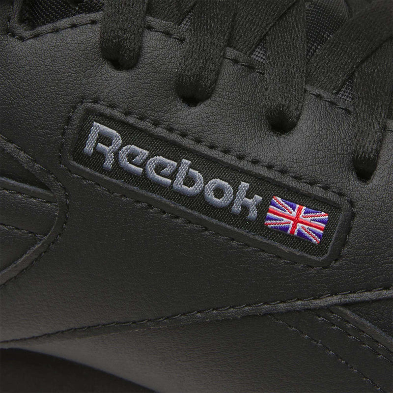 A close-up of Reebok Men's EX-O-FIT Hi Shoes, highlighting their retro leather design.