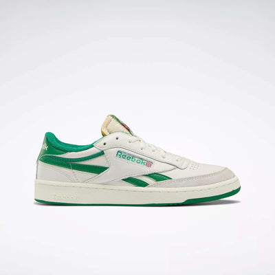 The Reebok Men's Club C Revenge Vintage Shoes feature white uppers with green accents, a green sole, heel, and side details. Shown in a side profile view against a light background, these tennis-inspired sneakers deliver classic retro comfort.