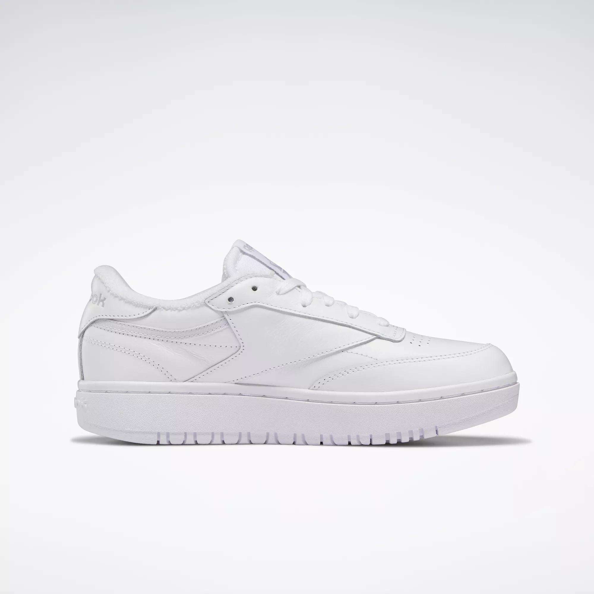 The Reebok Women's Club C Double Shoes are white low-top sneakers with a clean, minimalist tennis-inspired design, shown in profile on a plain light background.