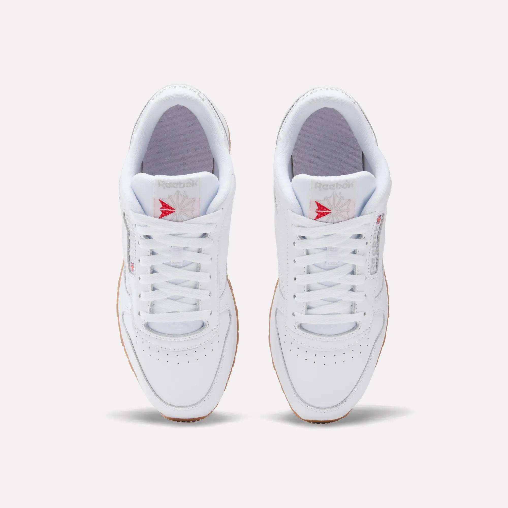 Top view of Reebok Classic Leather Shoes with a leather upper, gum soles, white laces, and the gray/red Reebok logo on the tongue, displayed on a plain light background for retro flair.