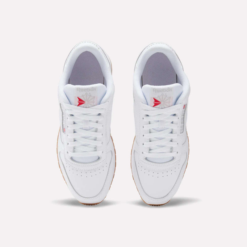 Top view of Reebok Classic Leather Shoes with a leather upper, gum soles, white laces, and the gray/red Reebok logo on the tongue, displayed on a plain light background for retro flair.
