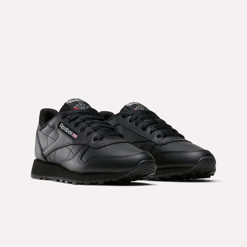 Reebok Women's Classic Leather Shoes in black with matching laces and the signature logo on the side, shown on a light background—ideal versatile footwear for any casual look.