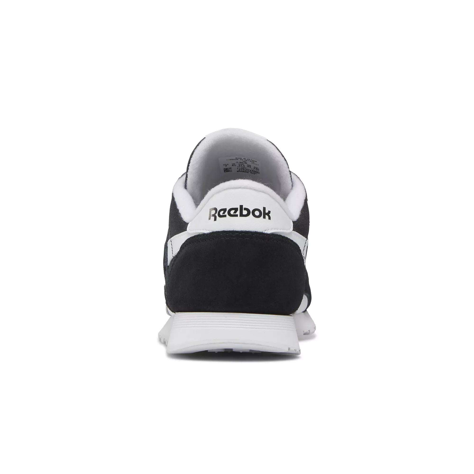 Rear view of the Women's Classic Nylon Shoes by Reebok, featuring a black and white suede design with the classic Reebok logo on the heel, shown against a plain white background.