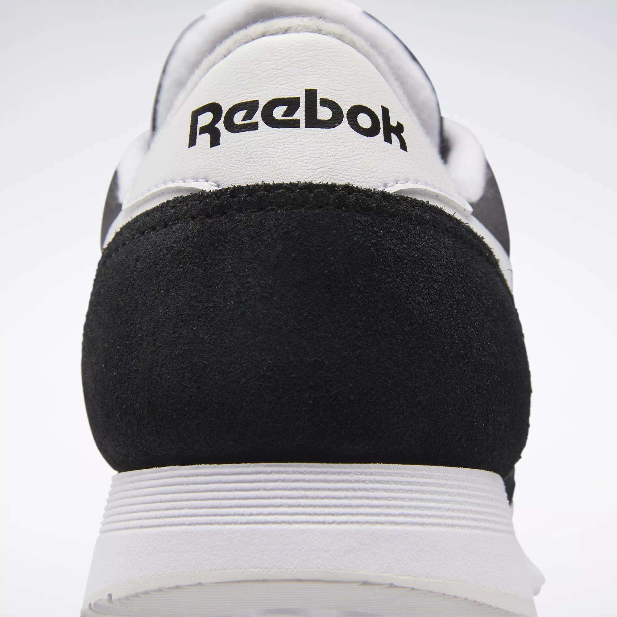 Close-up of the back of Men's Classic Nylon Shoes by Reebok, showing black suede and a white heel with the bold Reebok logo—ideal for anyone wanting classic everyday sneakers.