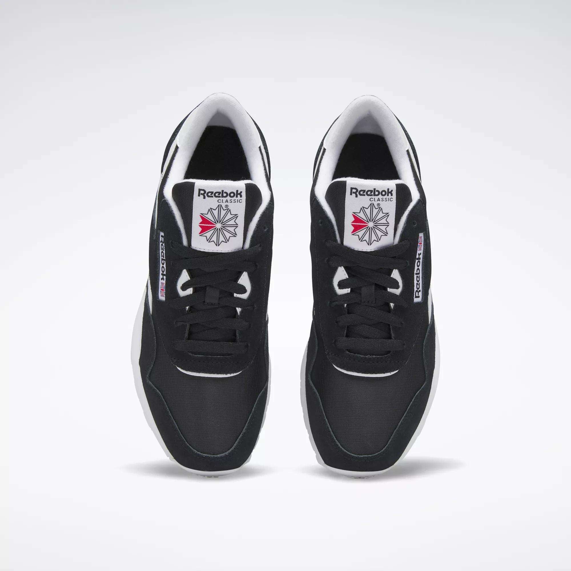 A pair of Men's Classic Nylon Shoes by Reebok in black with white soles and the Reebok logo on the tongue, viewed from above on a plain white background—perfect classic sneakers for everyday wear.