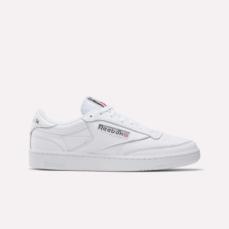 The Reebok Club C 85 Shoes are classic low-top sneakers in white leather, featuring the Reebok logo and Union Jack flag on the side, white laces, and a textured sole inspired by vintage tennis shoes.