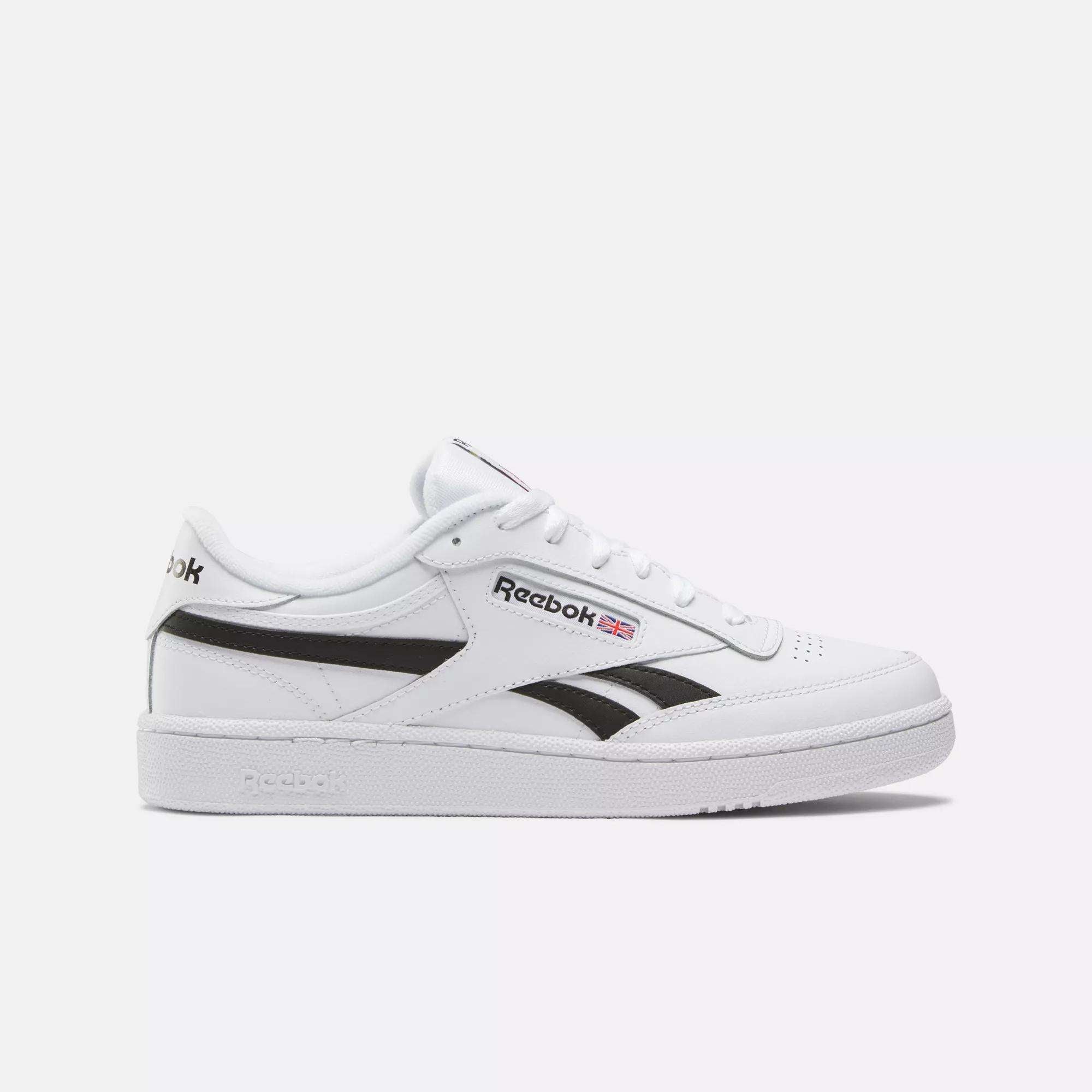 Reebok Club C Revenge Shoes in Ftwr White/Black/Ftwr White feature a black side stripe, white sole, and the Reebok logo with Union Jack—classic casual leather sneakers shown on a plain white background.