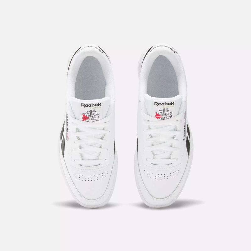 A top view of the Reebok Club C Revenge Shoes shows white trainers with black side accents and the Reebok logo in red and gray on each tongue.