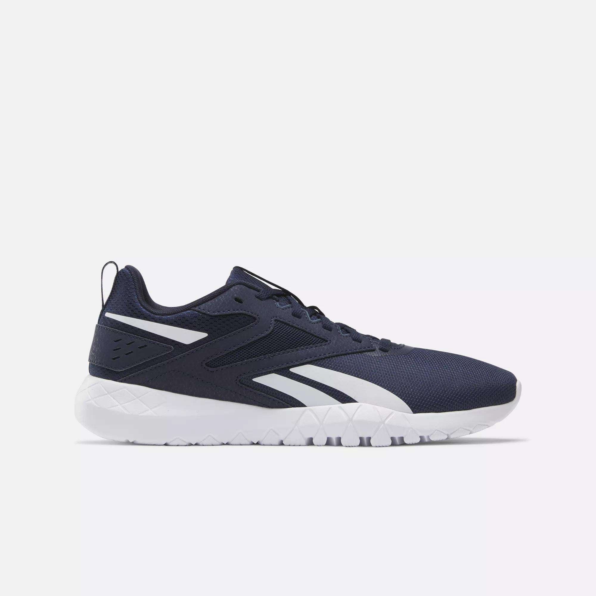 Men's Flexagon Energy 4 Training Shoes by Reebok in navy blue with white accents and sole, featuring a breathable mesh upper and geometric tread, displayed side profile on a plain light background.