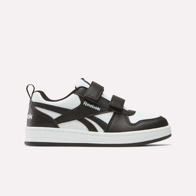 The Kids' Reebok Royal Prime 2 Shoes by Reebok are black and white sneakers featuring two hook-and-loop straps, a white sole, and the Reebok logo on the side, shown against a plain light background.
