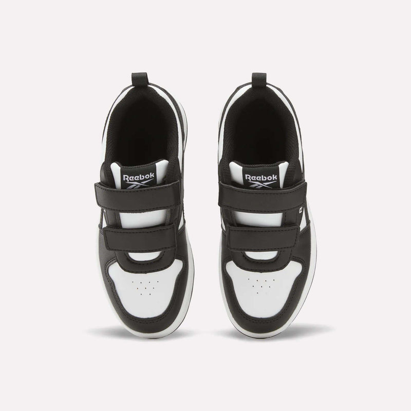 A pair of black and white Kids' Reebok Royal Prime 2 Shoes - Little Kids with hook-and-loop straps, seen from above, feature the Reebok logo on the tongue and perforated toe box detail.