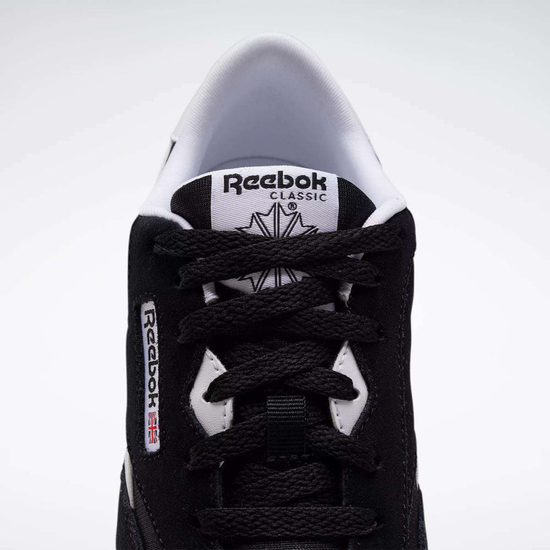 Top view of Reebok Classic Nylon Shoes - Big Kids, in black with white accents, minimalist 80s-inspired design, visible laces, branded tongue, and side label featuring a small Union Jack flag.