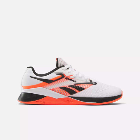 The Reebok Women's Nano X4 Training Shoes feature a white upper with black and orange accents, black logo, white laces, orange sole, mesh details on the side, and branding on the tongue and midsole—ideal lightweight trainers.