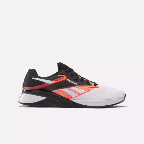 The Reebok Nano X4 Training Shoes are lightweight, featuring a white toe, black laces and heel, plus red-orange accents along the sides and heel. Shown in side profile against a plain light background.
