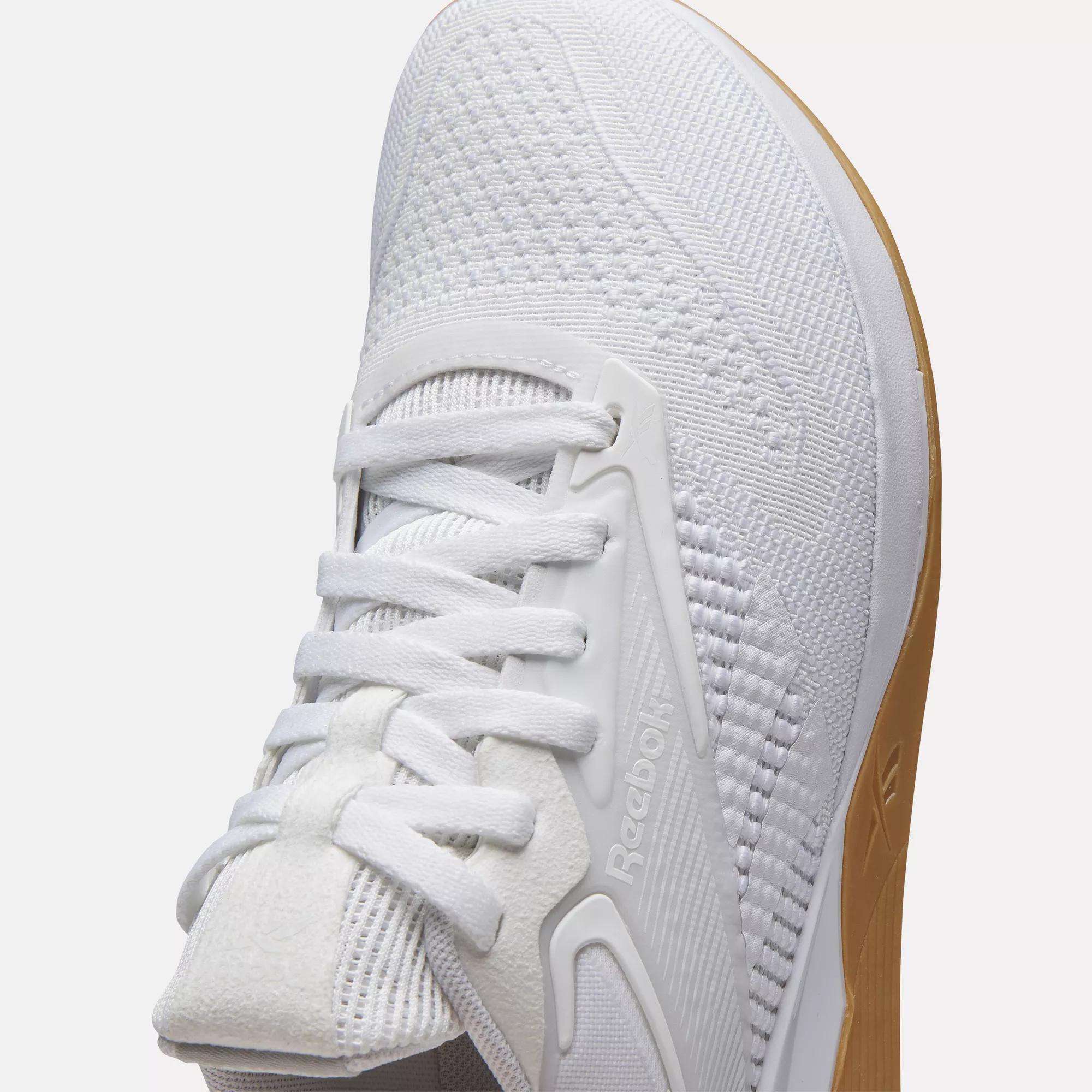Close-up of Reebok Women's Nano X4 Training Shoes with a textured knit upper, white laces, and light brown sole—lightweight, breathable trainers ideal for your daily workouts.