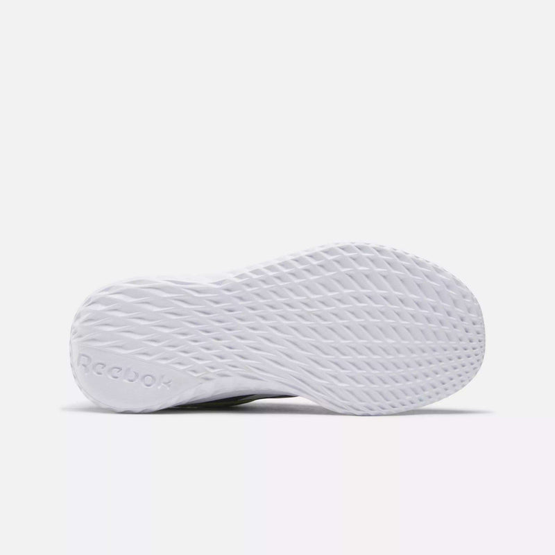 Bottom view of Reebok Rush Runner Slip-On Shoes for little kids, showing a textured, diamond-patterned sole for traction and lightweight cushioning. The embossed Reebok logo appears near the heel. Background is plain white.