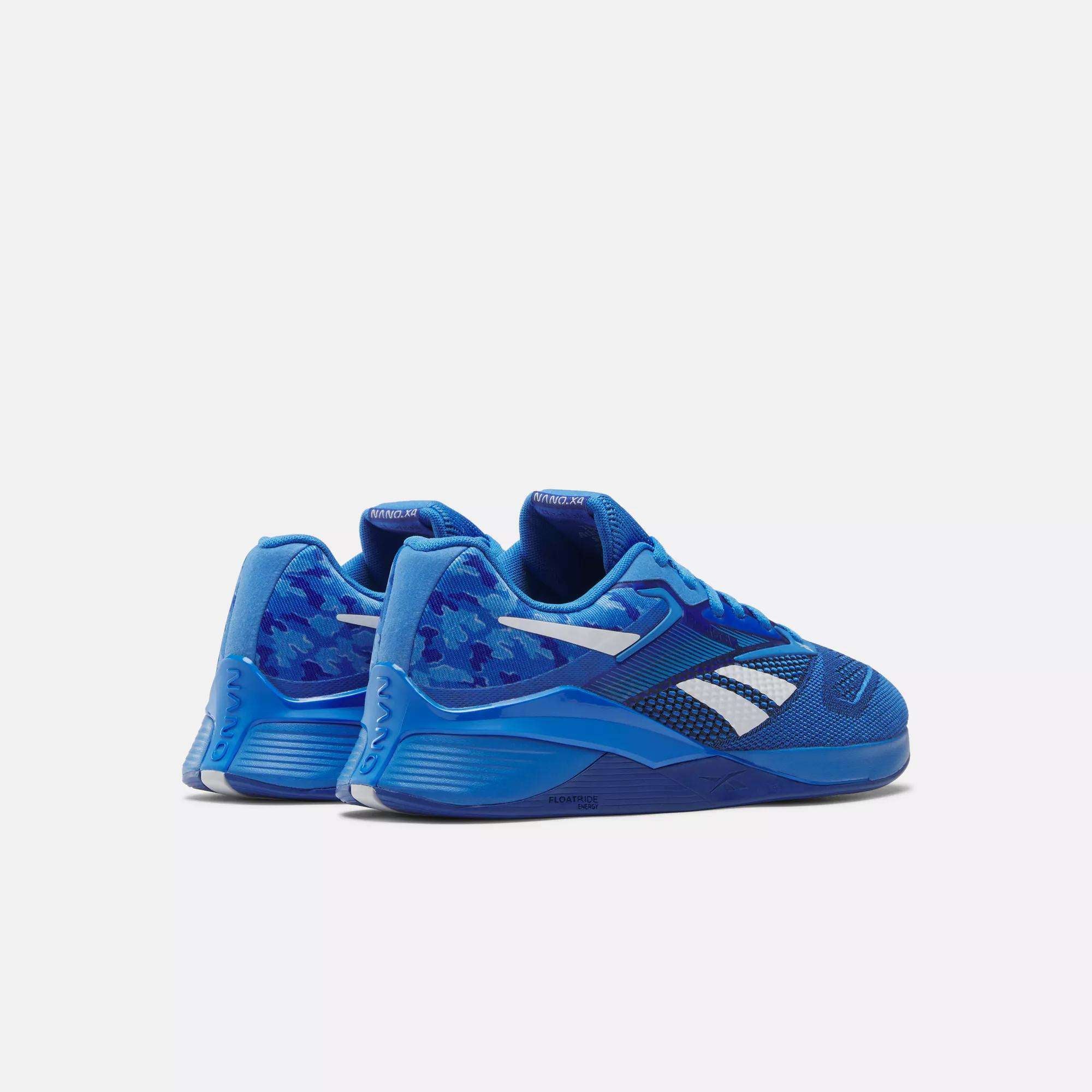 The Reebok Nano X4 Training Shoes are blue with white accents and a camouflage heel, shown on a light background. They feature lightweight mesh details and a chunky sole for enhanced comfort.