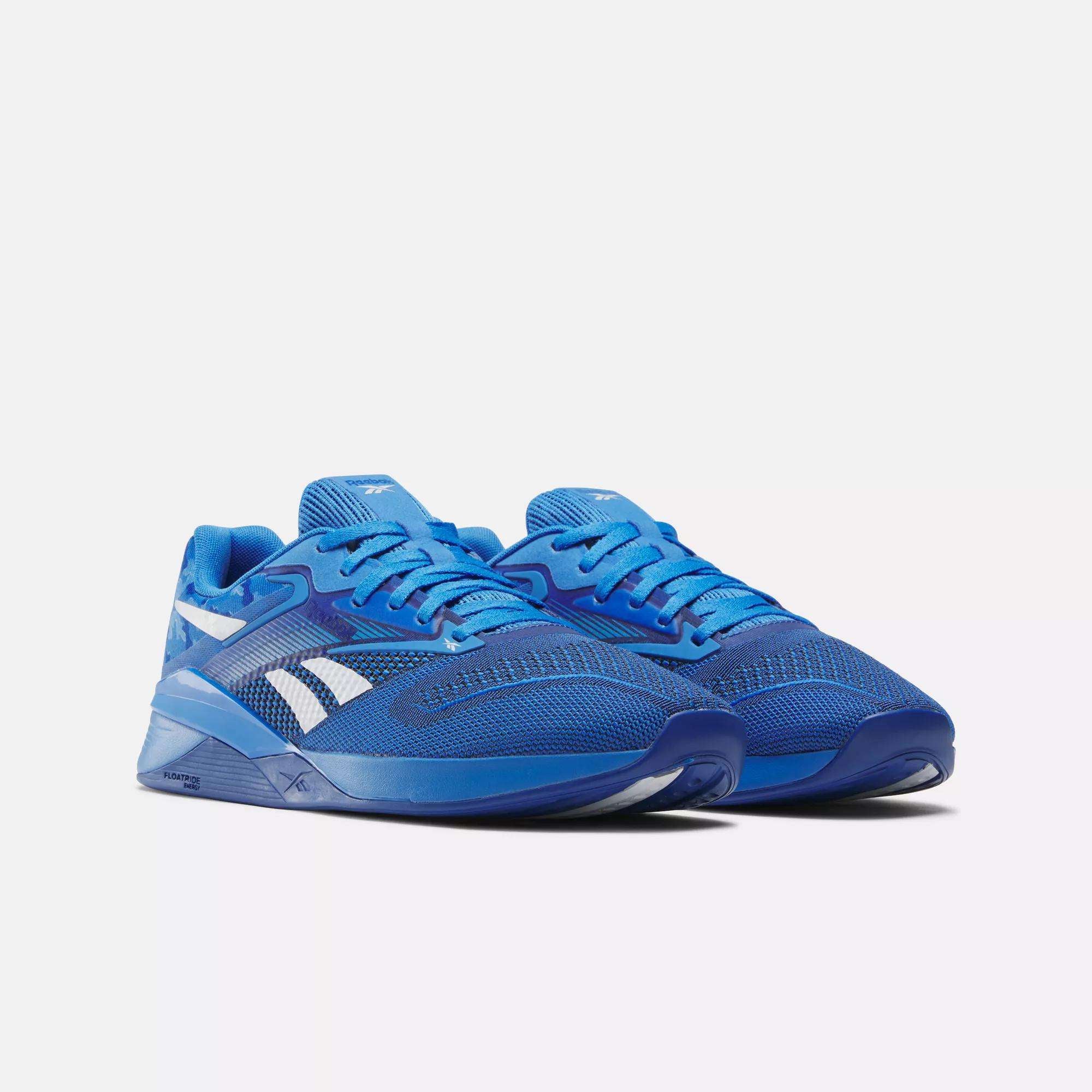 A pair of Reebok Nano X4 Training Shoes in bright blue with white accents, featuring breathable mesh uppers and lightweight rubber soles, displayed on a plain light background.