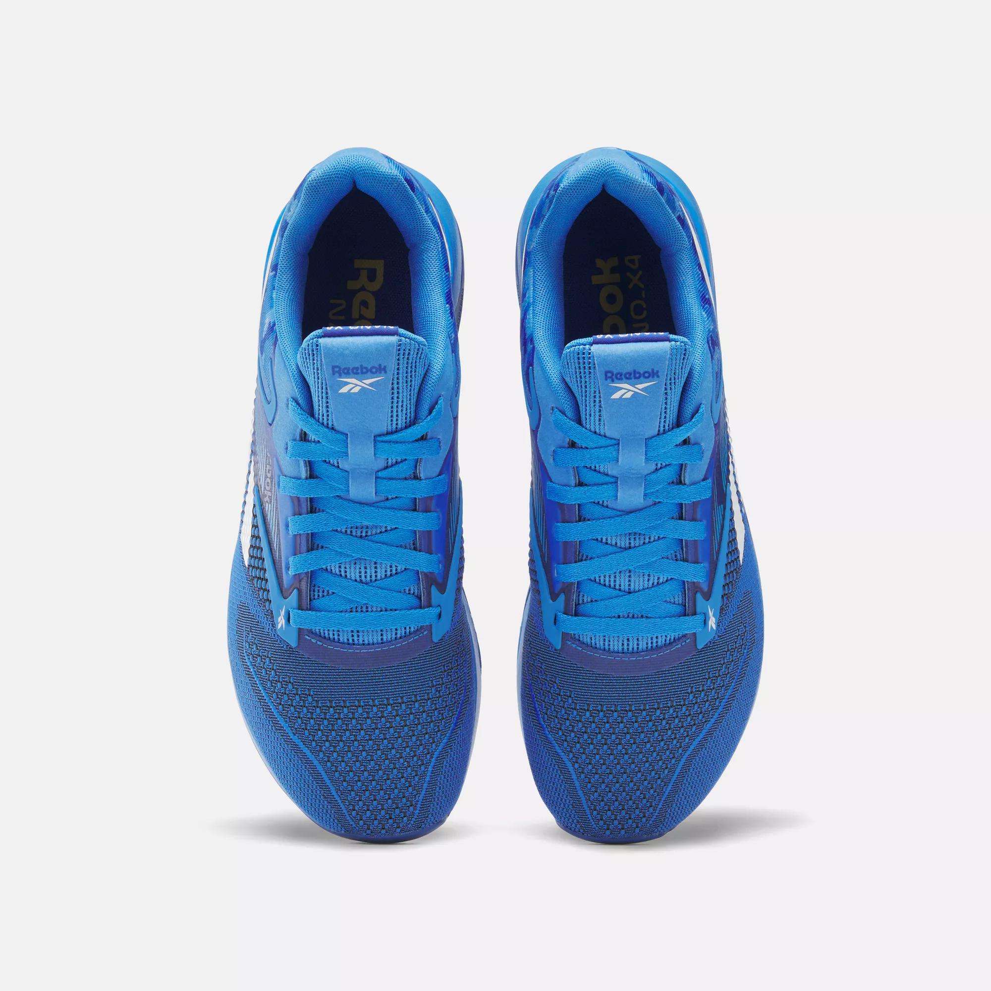 Top view of a pair of Reebok Nano X4 Training Shoes in blue with white accents, displayed side by side on a plain white background.