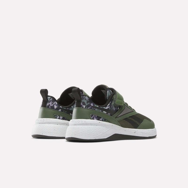The Reebok Nano Play Stretch Lace And Top Strap Shoes for little kids are shown from the back in green with black and dark camo details, white soles, and black pull tabs—perfect as boys' training shoes in a kid-sized Nano style.