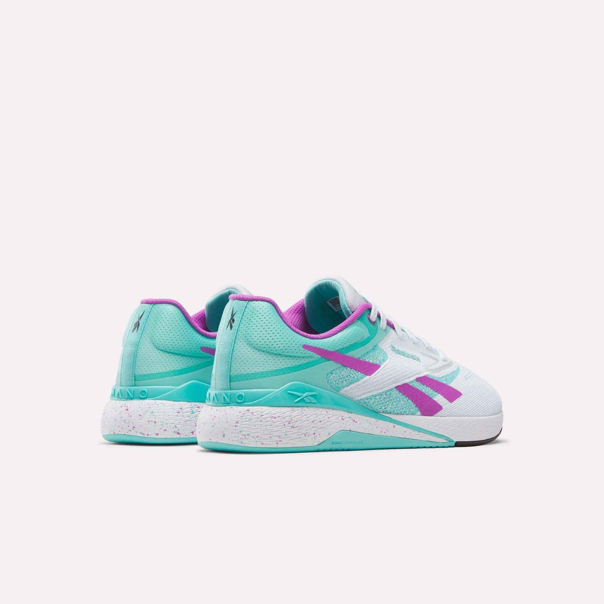 Reebok Nano X5 Training Shoes in white, teal, and purple feature a speckled midsole and are shown from an angled rear view on a white background—ideal men’s sneakers combining style and performance.