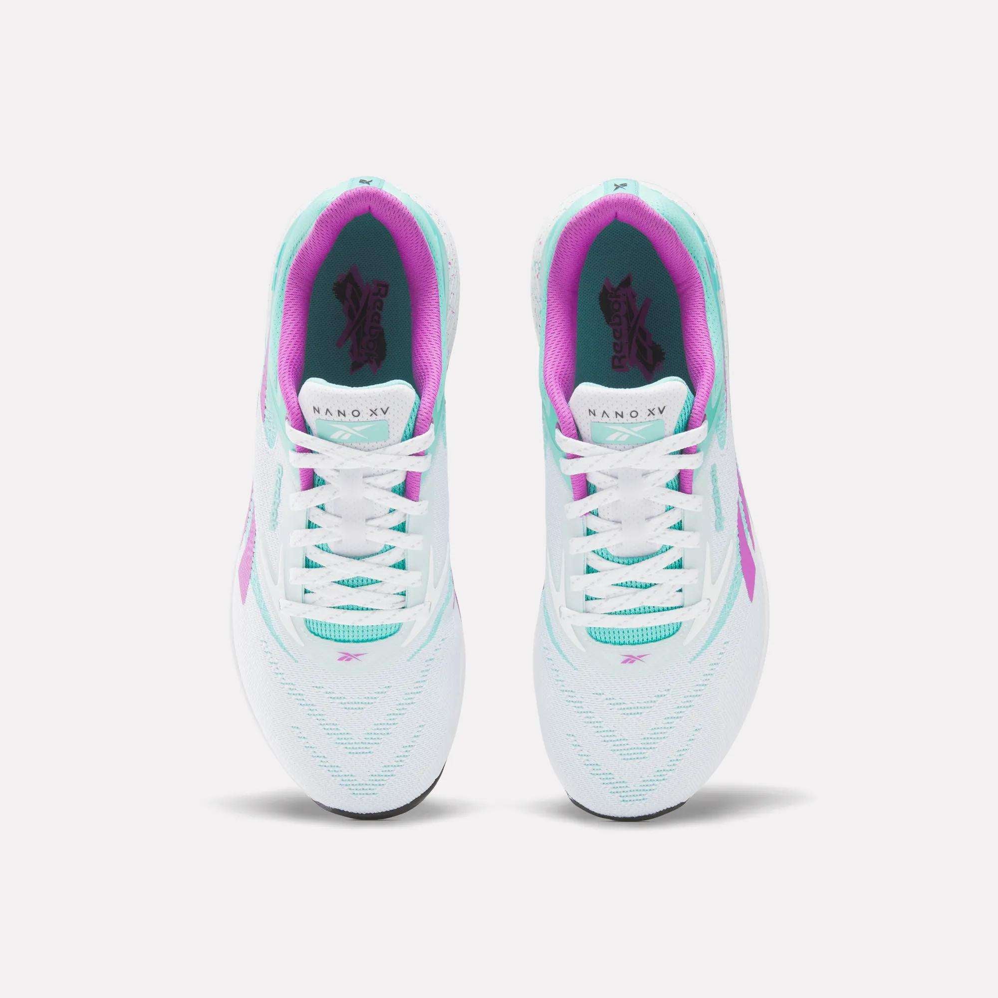 A pair of Reebok Nano X5 Training Shoes in white with teal, purple, and pink accents shown from above on a plain white background.