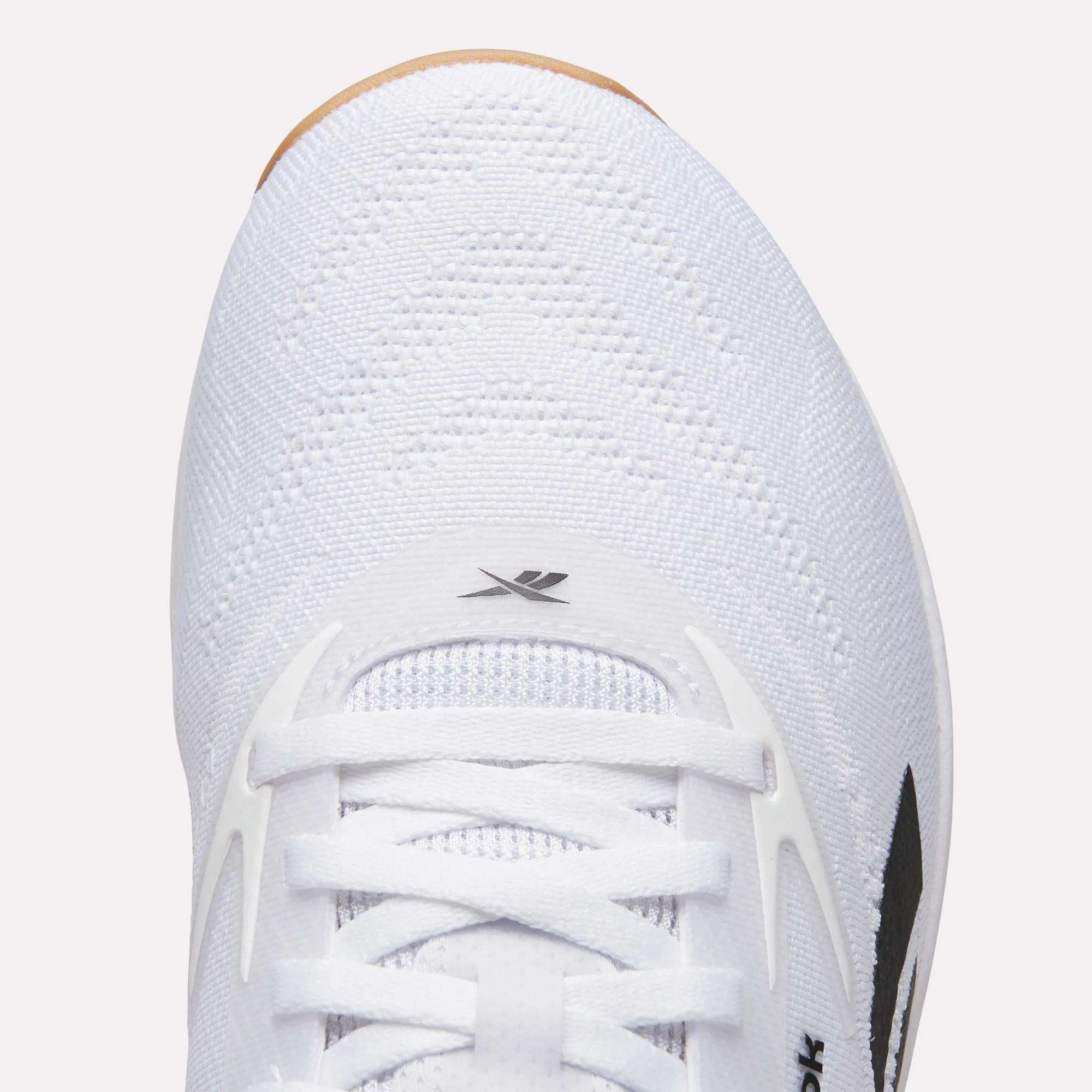 Close-up top view of the Reebok Nano X5 Training Shoes, featuring a textured mesh upper, white laces, small logo near the toe, and partial black side design—ideal for those seeking comfortable training footwear.