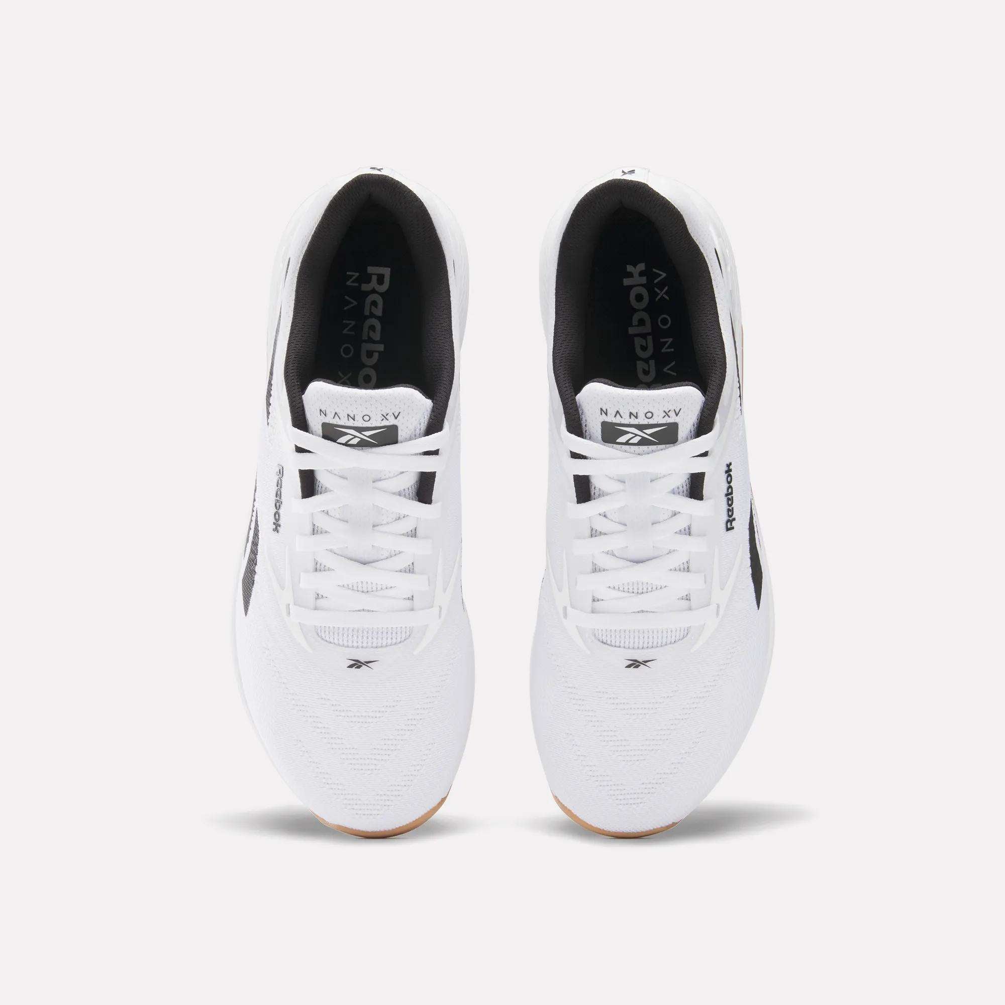 Top view of a pair of white Reebok Nano X5 Training Shoes with black interior lining, black Reebok logos, and subtle black accents—designed for comfort and ideal for those seeking comfortable running shoes.