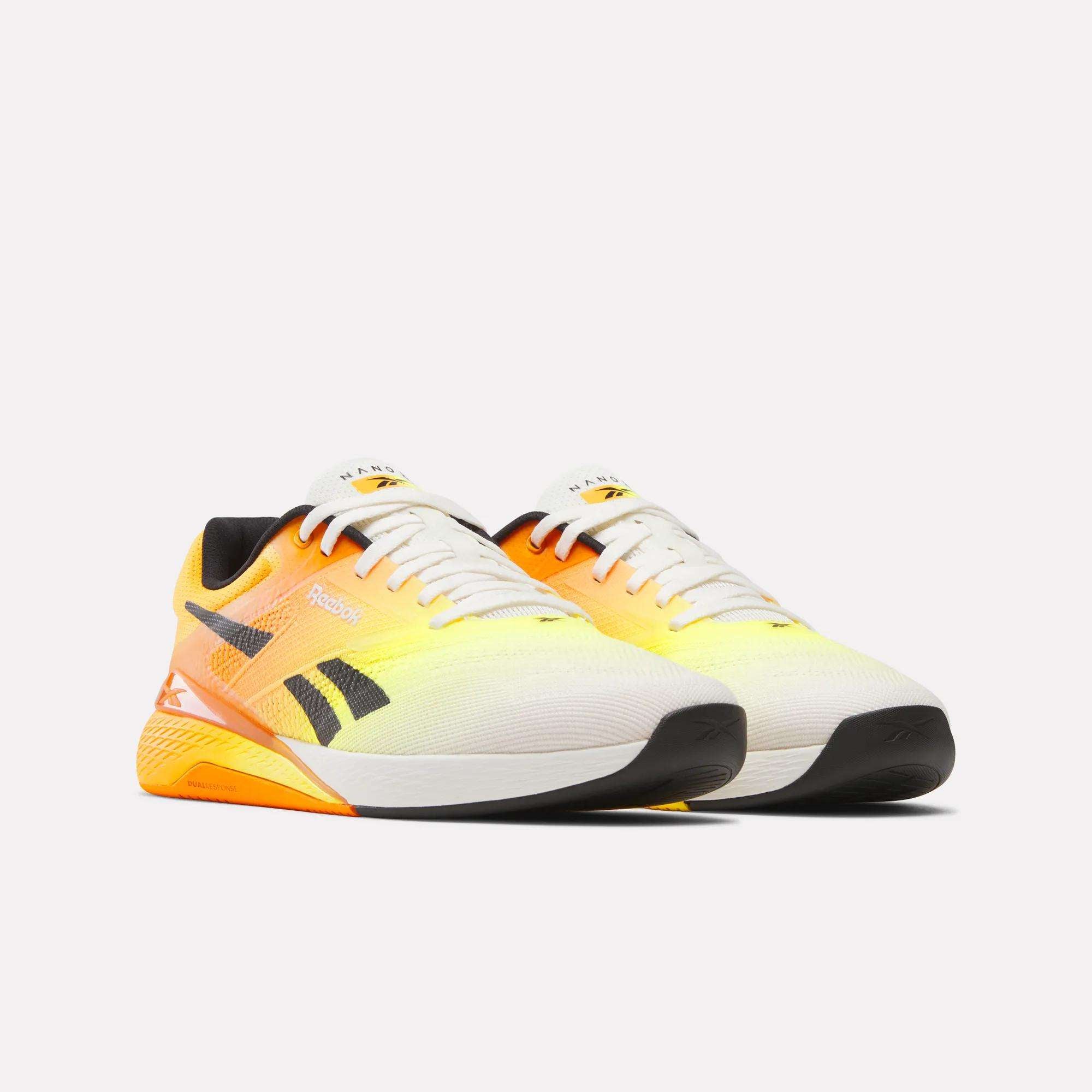 Reebok Nano X5 Training Shoes for men featuring a gradient yellow-to-orange design, black accents, and white soles—iconic trainers displayed on a plain white background.