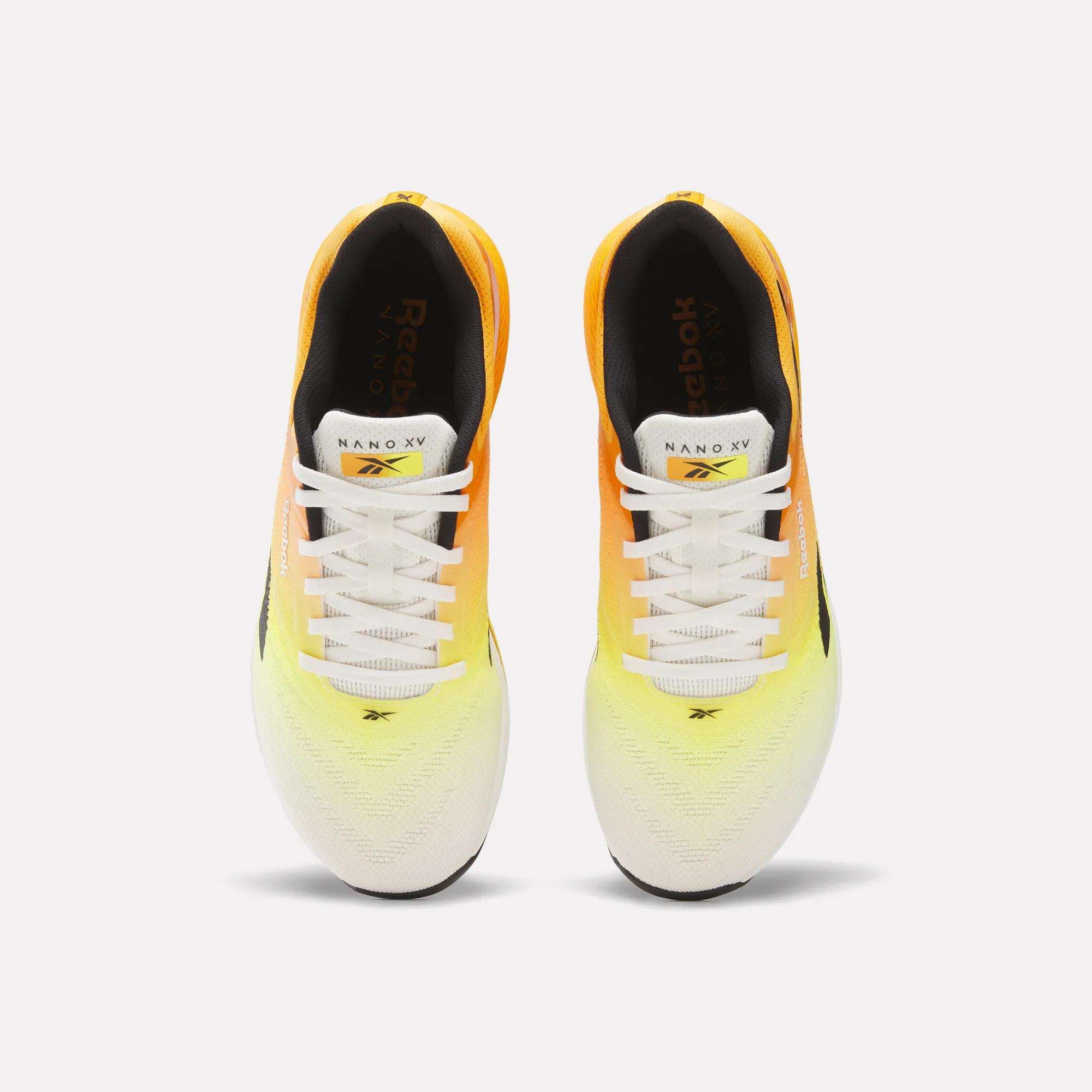 Top view of Reebok Nano X5 Training Shoes for men, showcasing a gradient yellow-to-white design, white laces, and black interiors, arranged side by side on a white background.