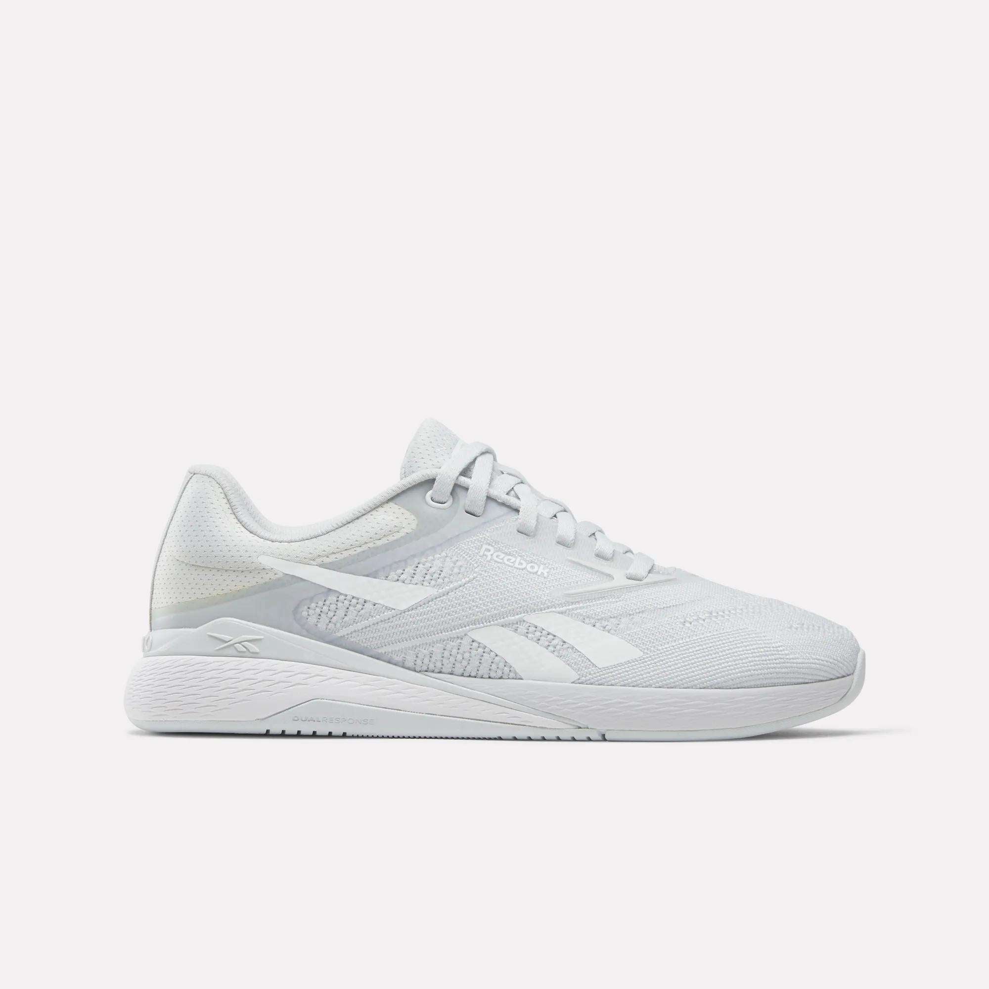 The Women's Nano X5 Training Shoes by Reebok feature a white mesh upper, lace-up closure, and side logo—shown in profile on a white background—offering stylish comfort for women's training.