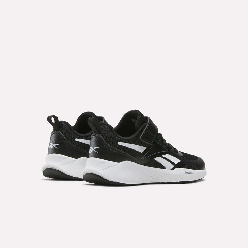 A pair of Reebok Energen Running Shoes for little kids, featuring black uppers, white soles, and white logo detailing, displayed on a light background.