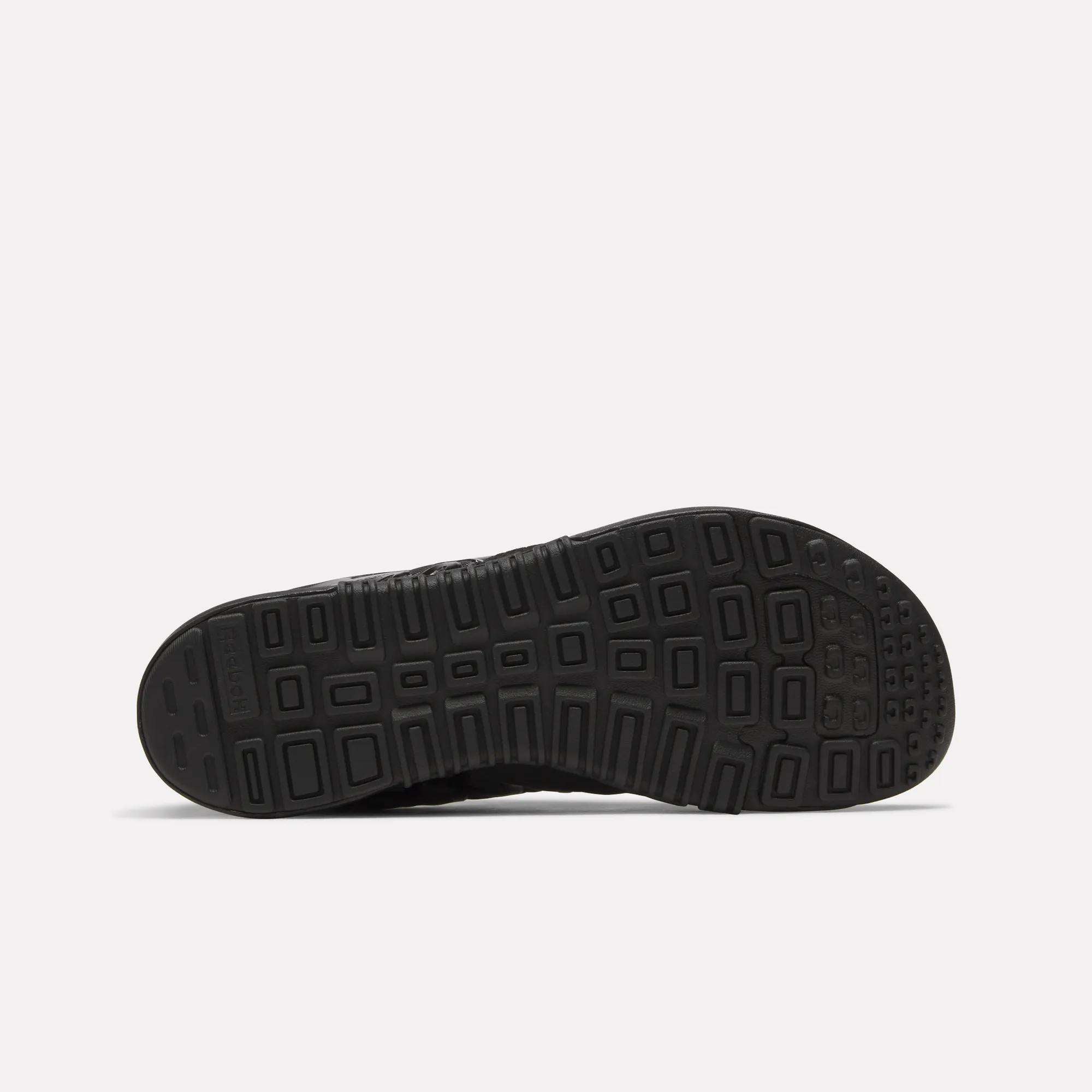 The textured black sole of the Reebok Men's Nano 2.0 Training Shoes features a geometric tread with rectangular and square shapes, shown from below against a white background—perfect for functional fitness.