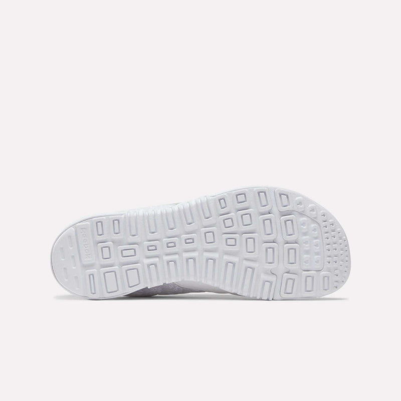 The image shows the white, textured sole of Reebok Women's Nano 2.0 Training Shoes, featuring square and rectangular patterns for grip and support—ideal for functional fitness—set against a plain light background.