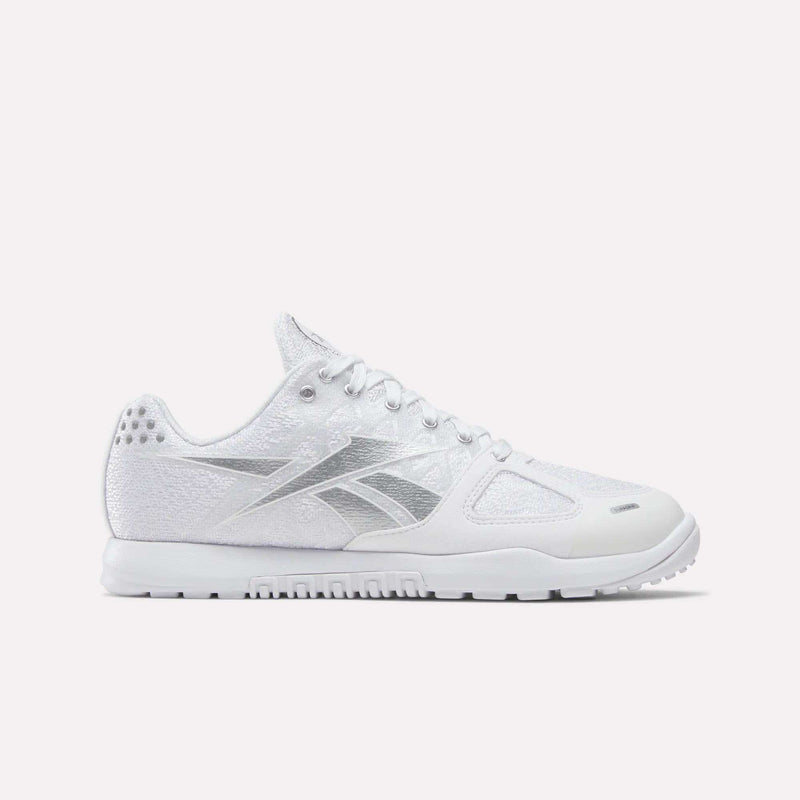 The Women's Nano 2.0 Training Shoes by Reebok feature a white design with silver accents, making them the ideal choice for women's functional fitness and training sessions.