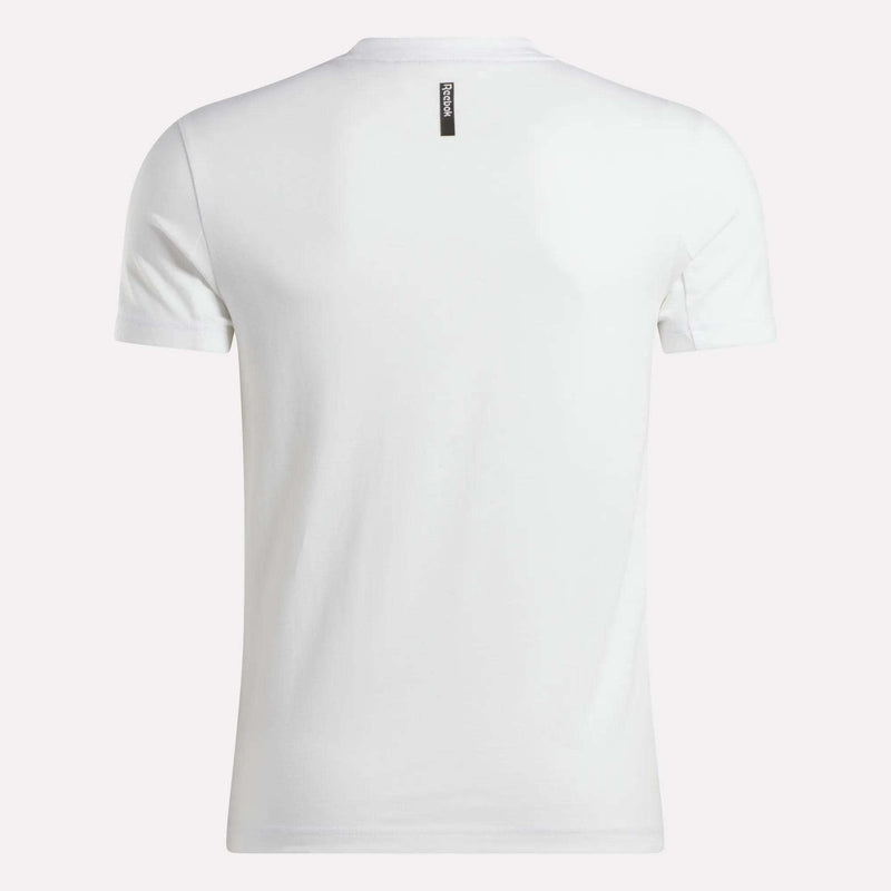 Back view of the Reebok Men's Athlete Training T-Shirt, shown in plain white with a slim fit. Features a small black rectangular tag with white text near the collar. The short-sleeve tee is displayed against a light background.