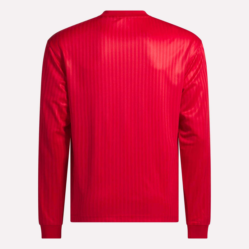 The Crosscheck Long Sleeve Jersey, shown from the back in bright red jacquard with subtle vertical stripes and plain cuffs, stands out against a light background.