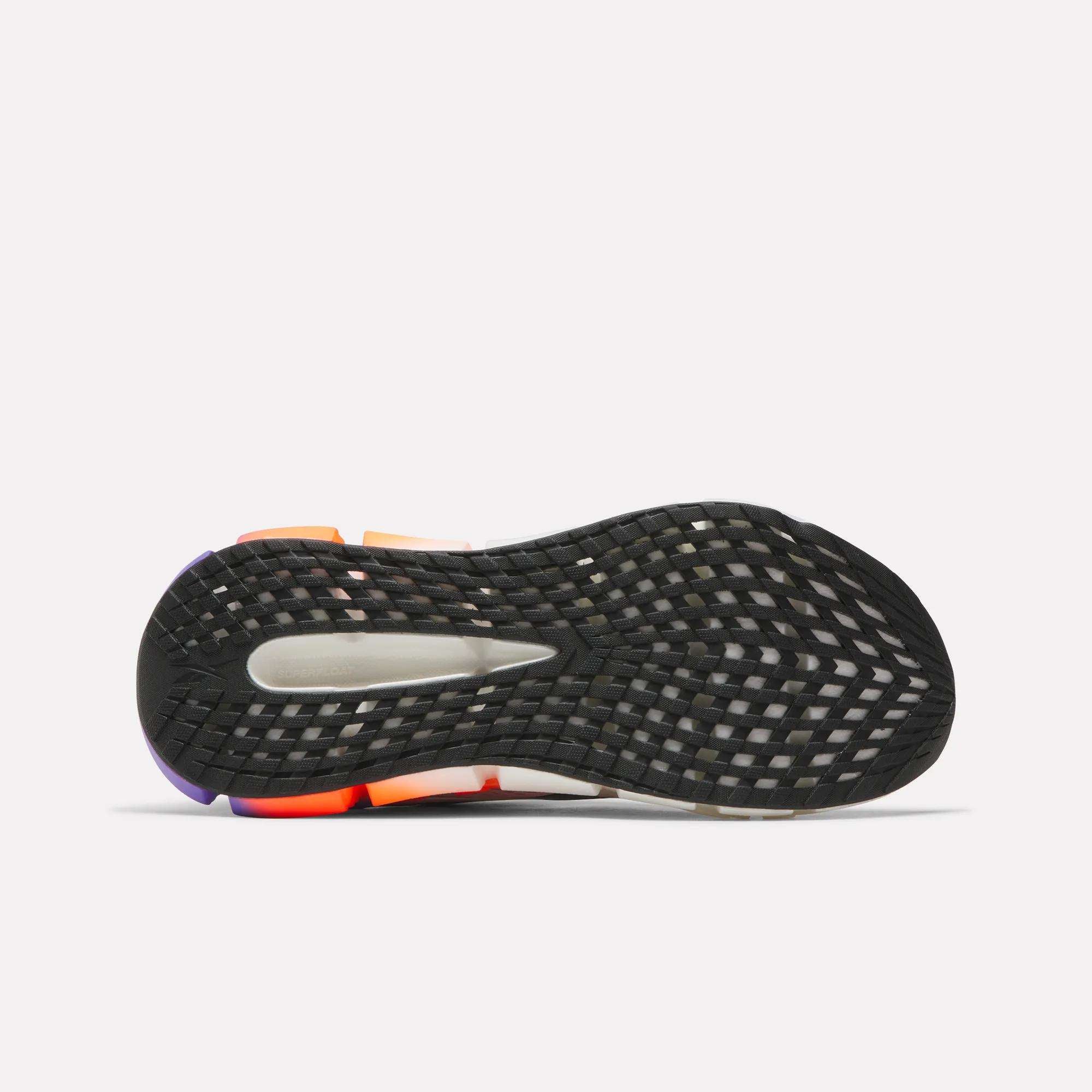 The image shows the black rubber outsole of the Reebok Men's FloatZig 2 Running Shoes, featuring a grid-like tread pattern and colorful side accents—showcasing its Superfloat+ cushioning—from a bottom view on a plain white background.
