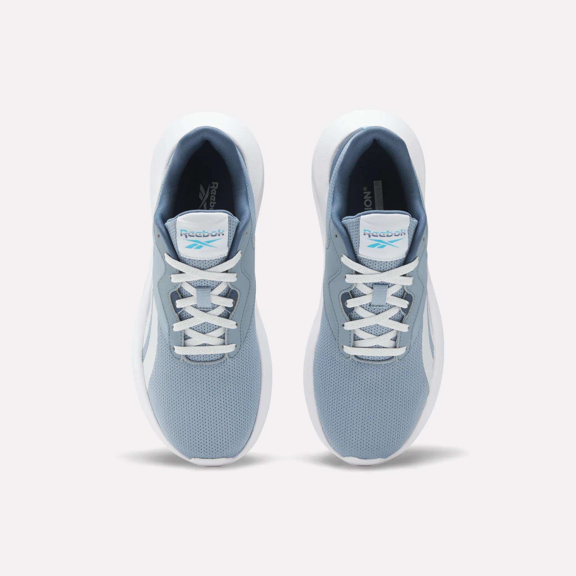 A pair of Reebok Women's Energen Lux Running Shoes in light blue and white, featuring mesh uppers, white laces, and the Reebok logo on the tongue, displayed from above against a plain white background.