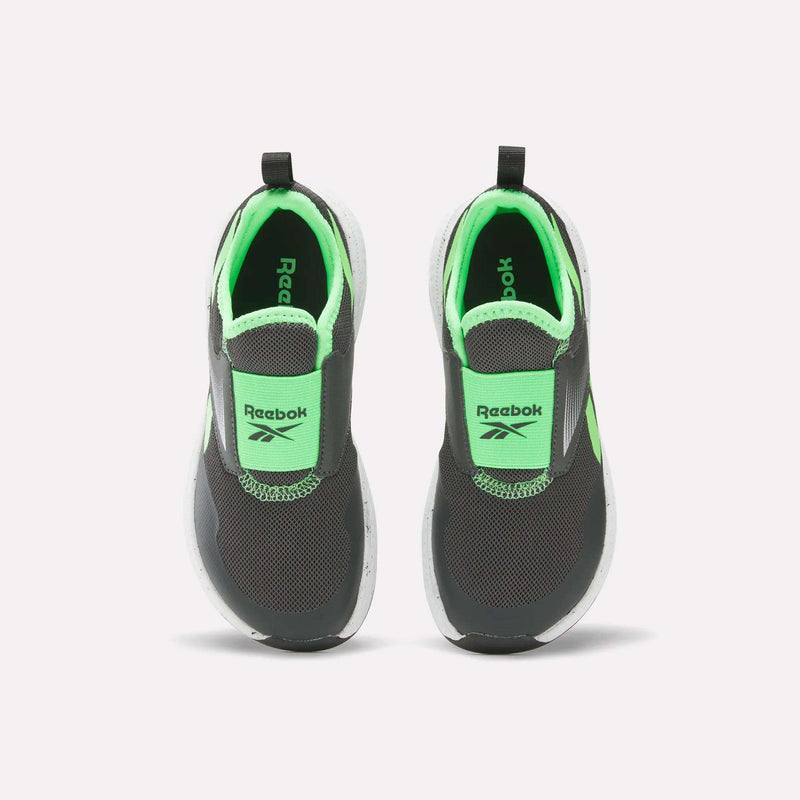 Top view of Reebok Nano Play Slip-On Shoes for little kids, featuring black and neon green colors, a slip-on design, white soles, breathable mesh fabric, and the Reebok logo on the tongue.
