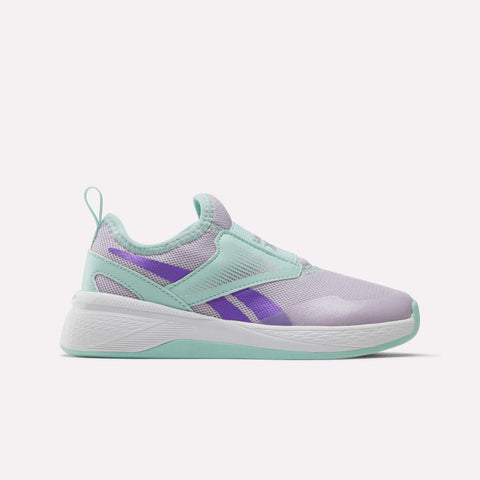 The Reebok Nano Play Slip-On Shoes for little kids feature a light purple upper, mint green accents on the sole, heel, and laces, plus purple side details—perfect addition to any kids’ Reebok collection. Displayed on a plain white background.