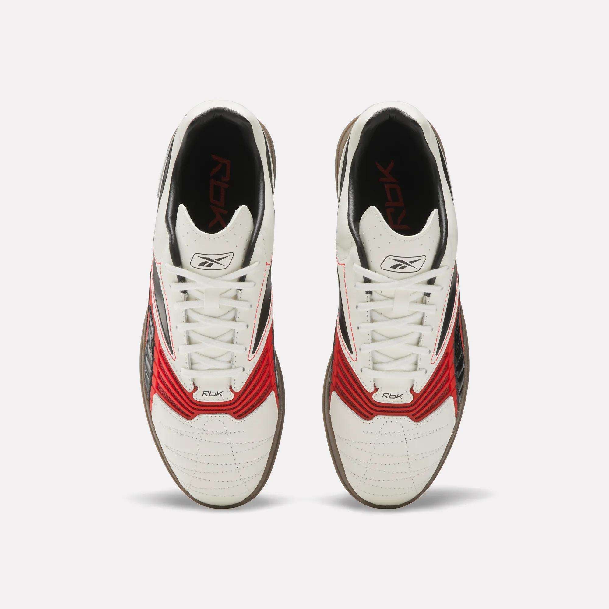 The Reebok Hammer Valde Shoes feature a white leather upper with red and black accents, viewed from above to display the laces and Reebok logos on the tongues and insoles, all set against a plain white background.