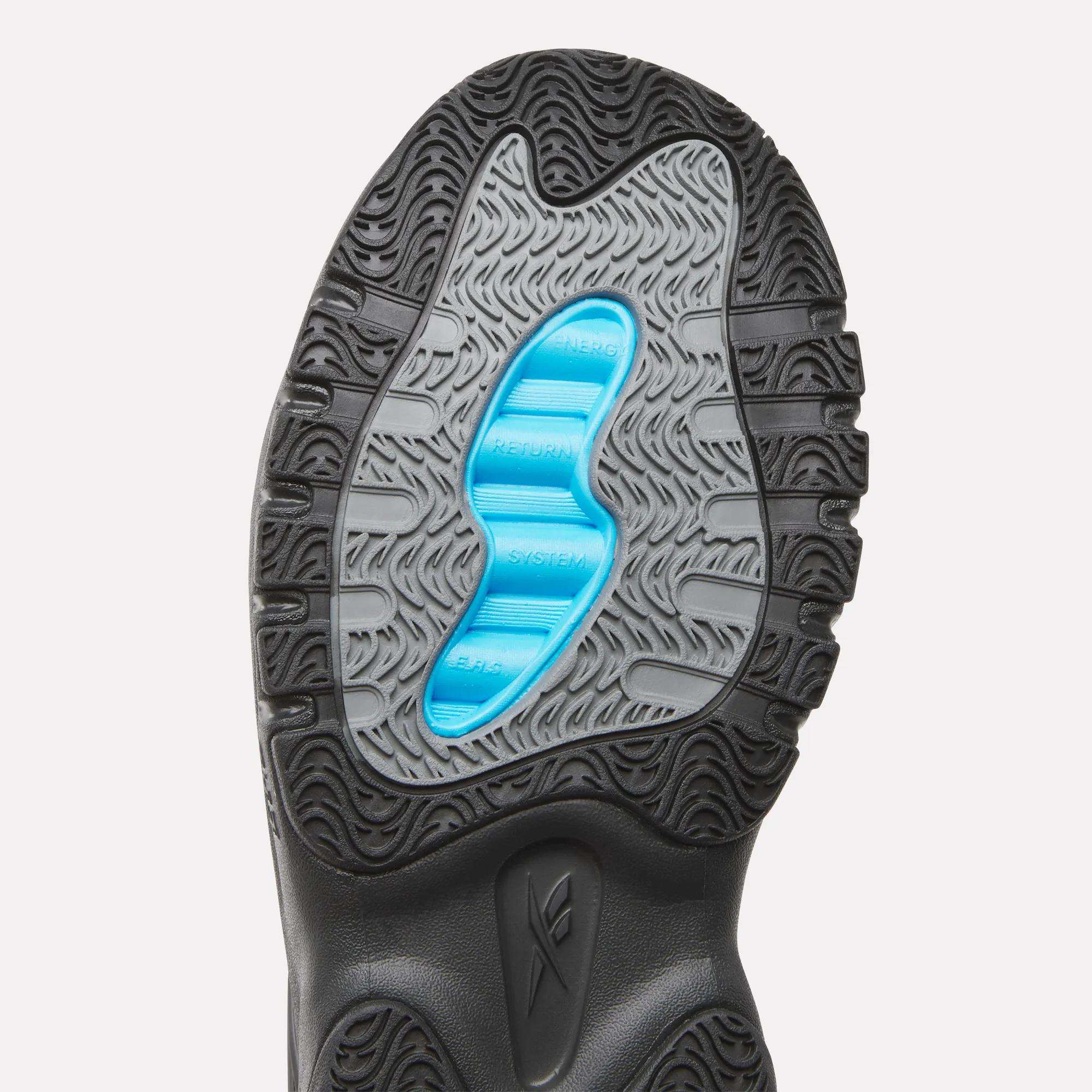 Close-up of the Men's ERS Training Shoes by Reebok shows a black and grey outsole with wavy textures and a blue center, highlighting premium cushioning ideal for training.