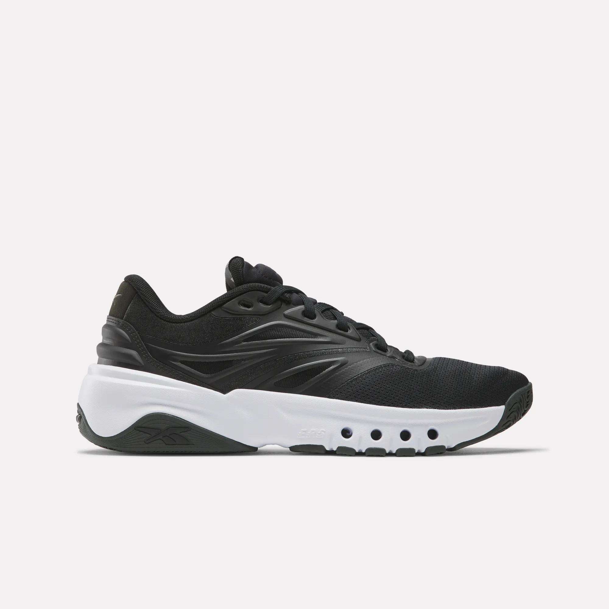 The Reebok Men's ERS Training Shoes in black feature premium cushioning and a thick white sole with circular cut-outs, displayed in a side view on a plain white background.